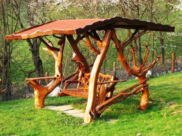 Garden swing with roof placed on the lawn