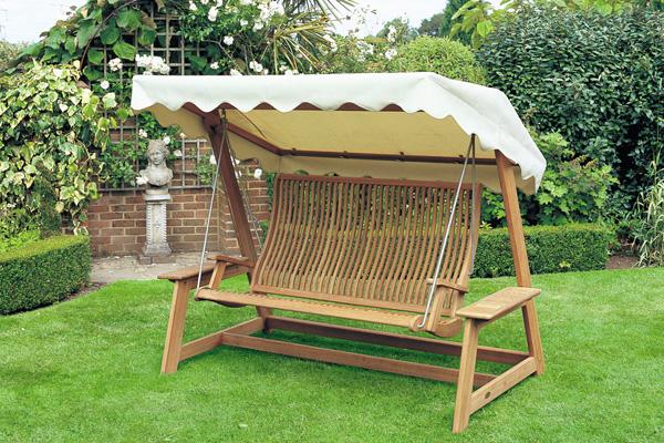 Garden swing with static construction placed in the home front lawn