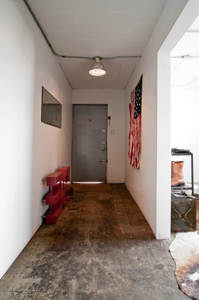 Industrial hallway with raw floor and  pendant