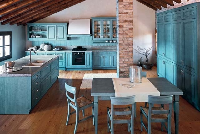 Kitchen design in cyan color and rustic barn beams on the ceiling