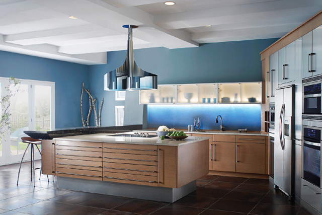 Kitchen design in luxurious home with island made of wood and bluish walls