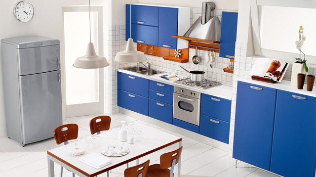 Kitchen design in modern style with blue cabinets and small table