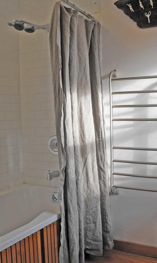 Linen bathroom curtain that separate the shower and the rest