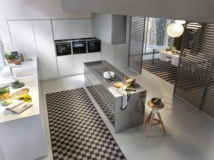 Minimalist kitchen in white with stainless steel island