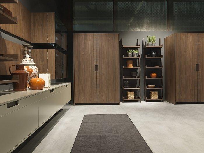 Modern kitchen with rack for flowers and cupboards made of wood