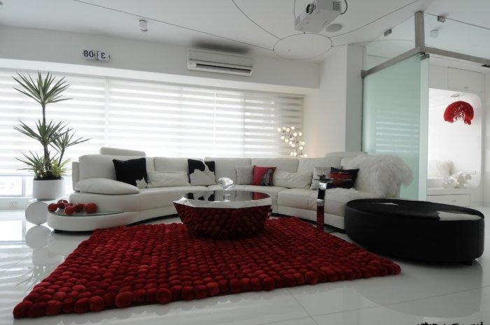 Modern living room with creative designer red rug