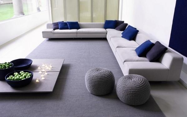 Modern puff stools inside a contemporary living room in soft colors