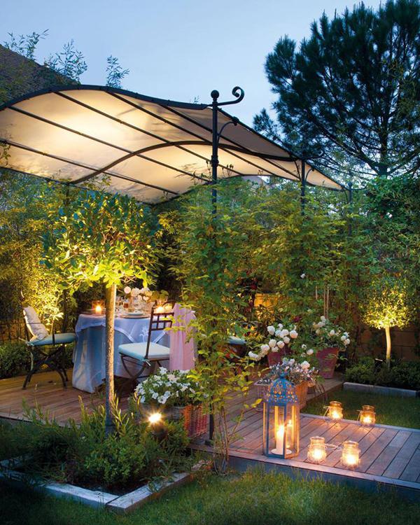 Outdoor dining area that is set for a romantic evening under the stars