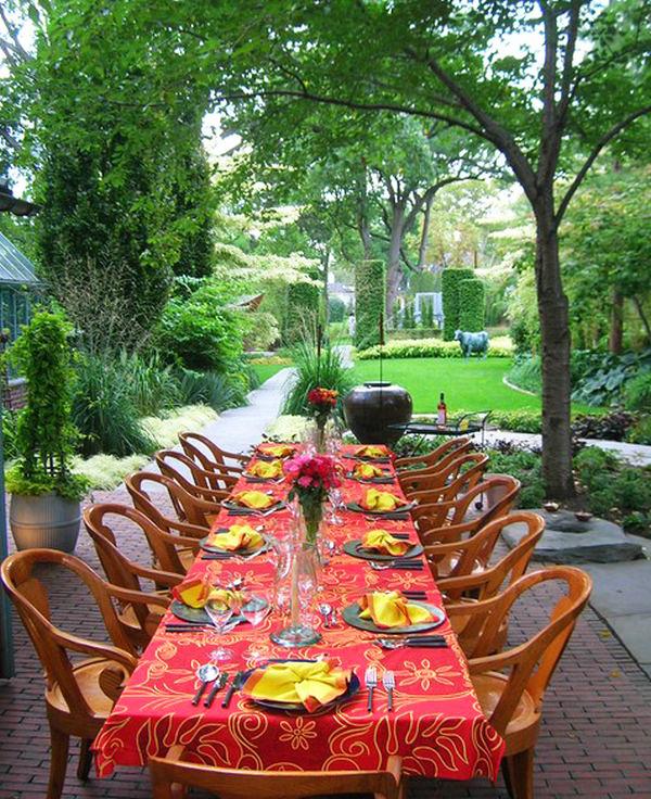 Outdoor dining area with long table and a lot of chairs