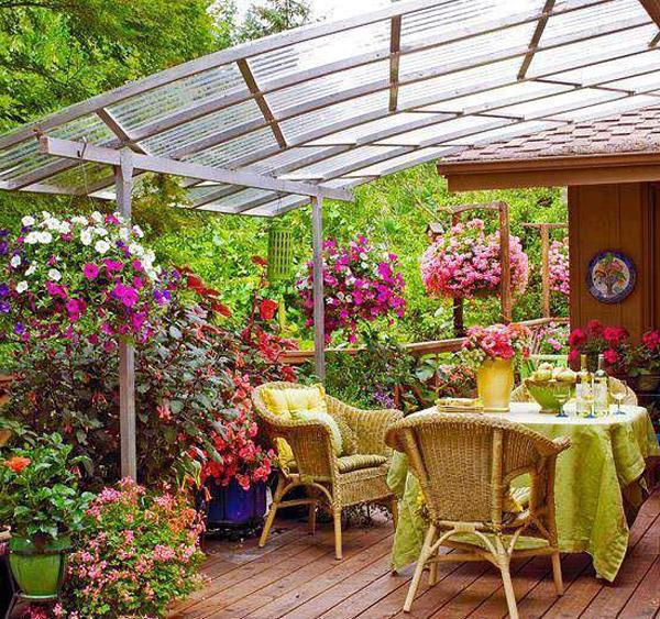 Outdoor table with chairs under a veranda shelter