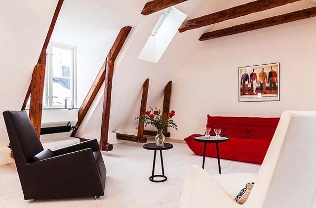 Scandinavian living room with barn beams on the walls and ceiling