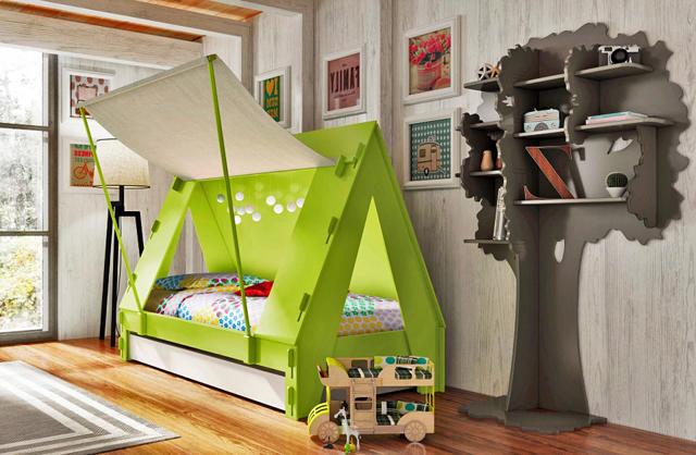 Tent caravana in green color placed in a kids room