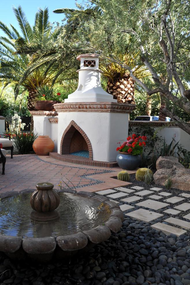 Arabic Mediterranean style inside a garden with small decorative fountain and an outside furnace