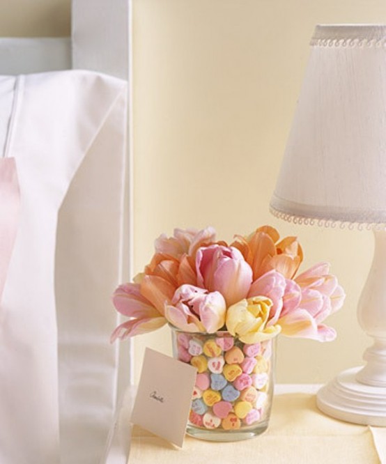 Colorful tulips inside a vessel decorated with different buttons