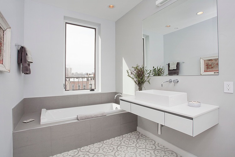 Eclectic bathroom with grey bathtub