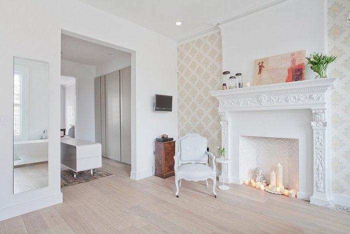 Eclectic bathroom with white fireplace and decorative candles