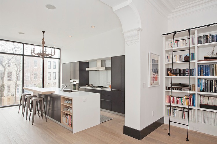 Eclectic kitchen and home library in white