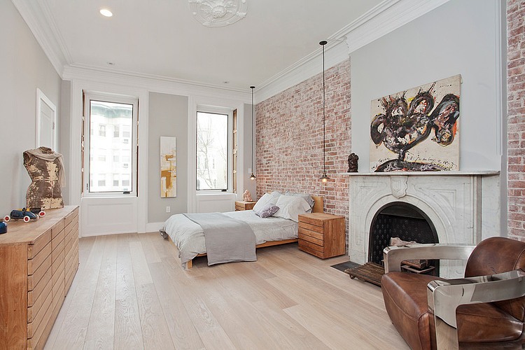 Ecletic bedroom with brick walls and white interior