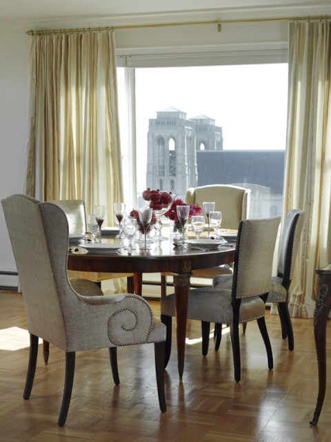 Feminine dining room with traditional chairs and wooden table