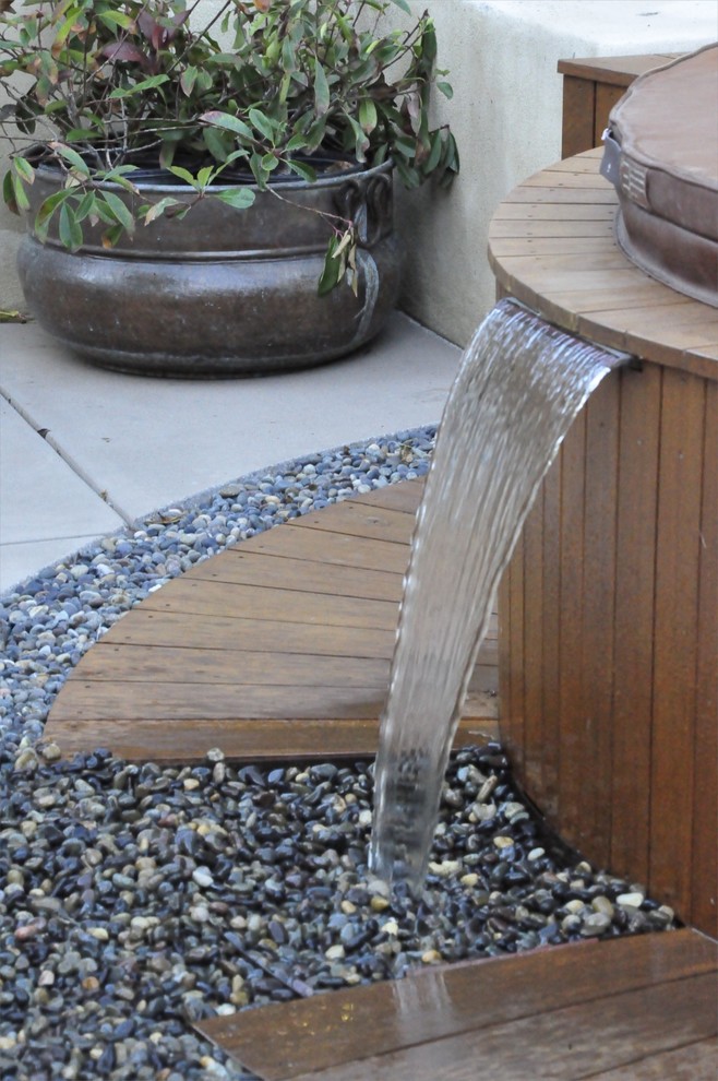 Japanese garden with water features and a small fountain