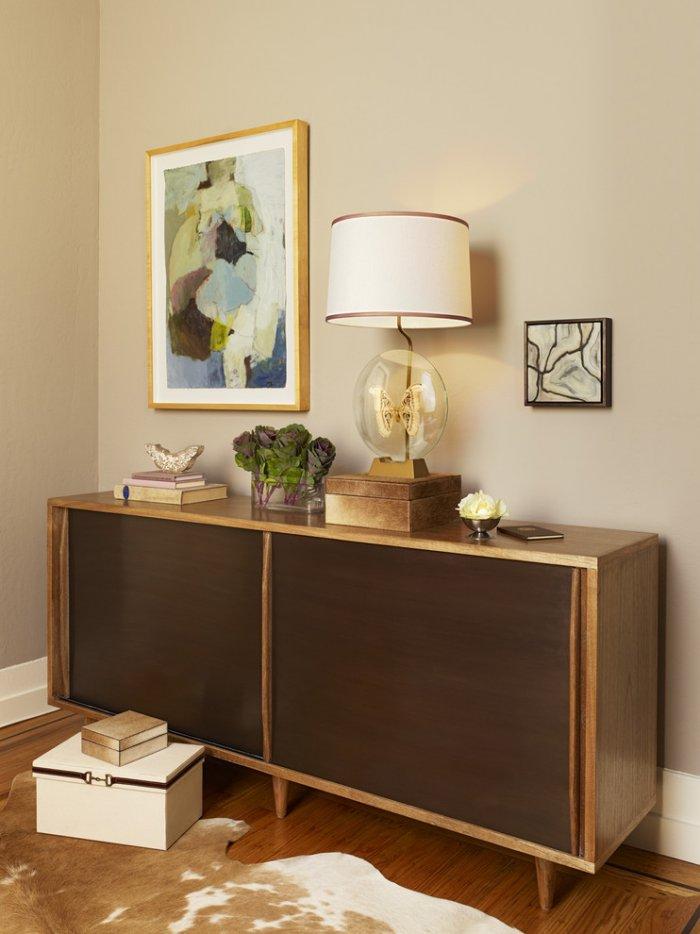 Mid-century modern drawer with interesting lamp and abstract wall painting