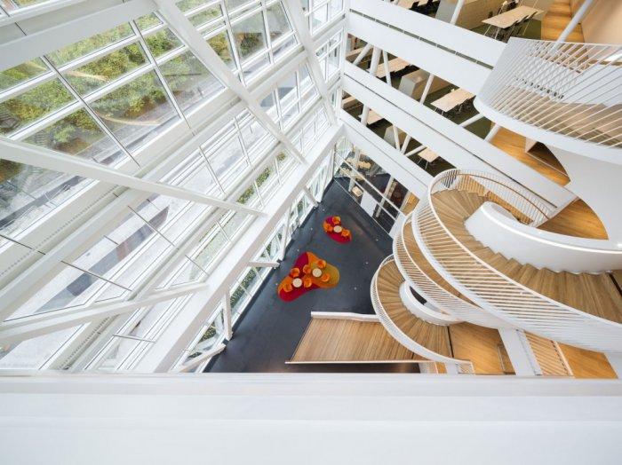 Modern bank interior with spiral staircase connecting each of the seven floors