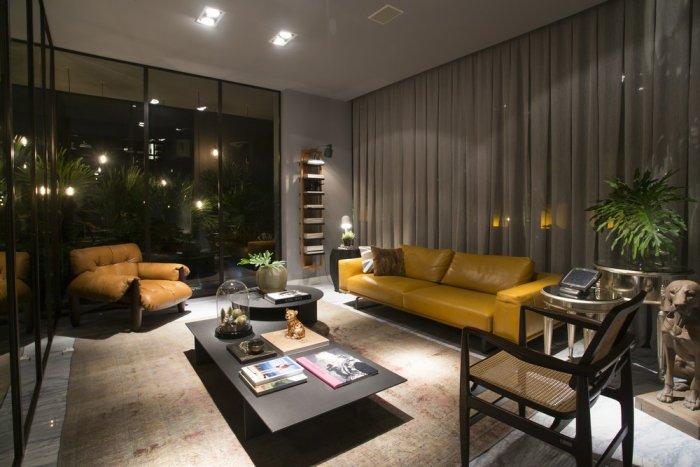 Modern loft living room with yellow leather sofa and low in height coffee table