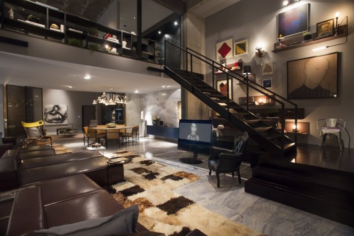 Modern open plan loft with stairs leading to the second floor