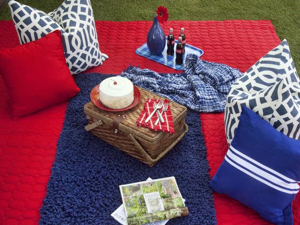 Patriotic Picnic idea with white cushions, red rugs and blue pillows