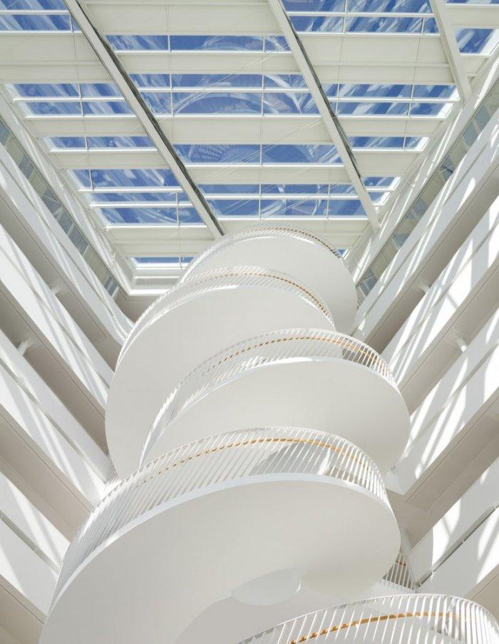 Spiral staircase in a commercial building and glass roof