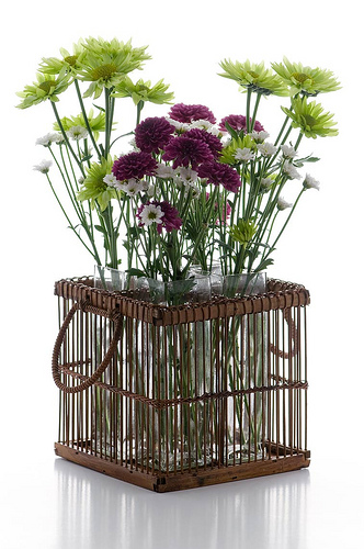 Spring flowers inside a knit basket that can be used in the living room