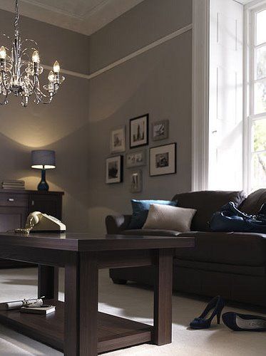 Brown furniture in a dark colored living room