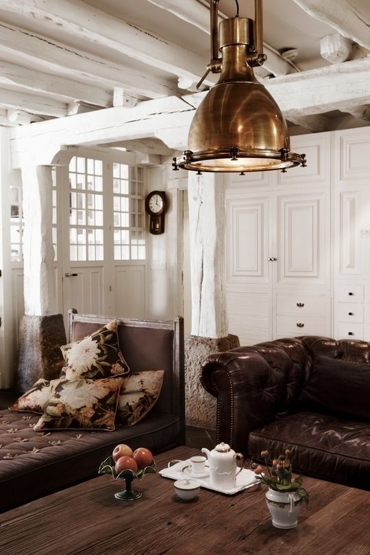 Brown rustic living room with industrial metal pendant