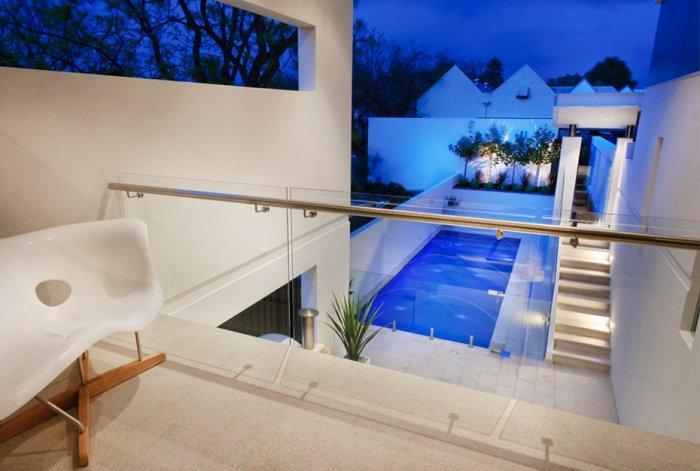 Contemporary terrace overviewing the swimming pool on the ground floor