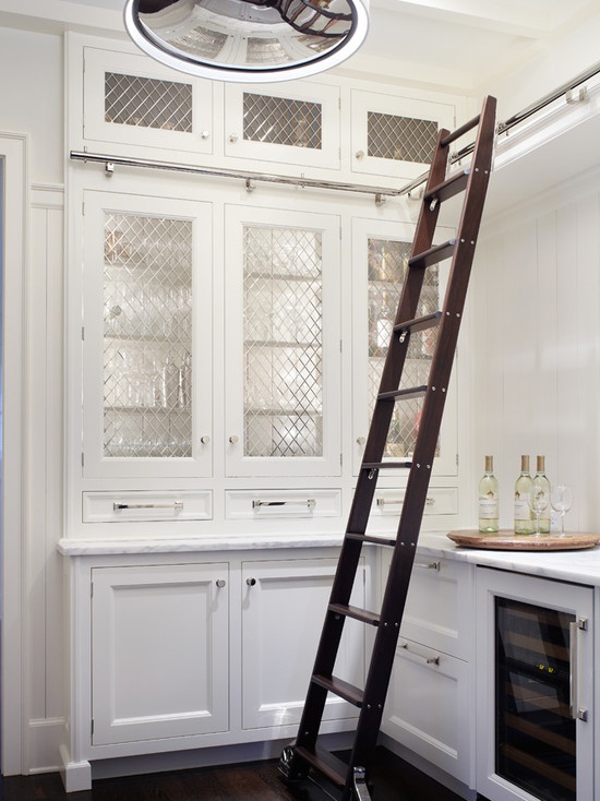 Creative kitchen design with white cabinets and walls