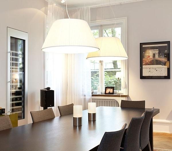 Eclectic dining room with white pendants