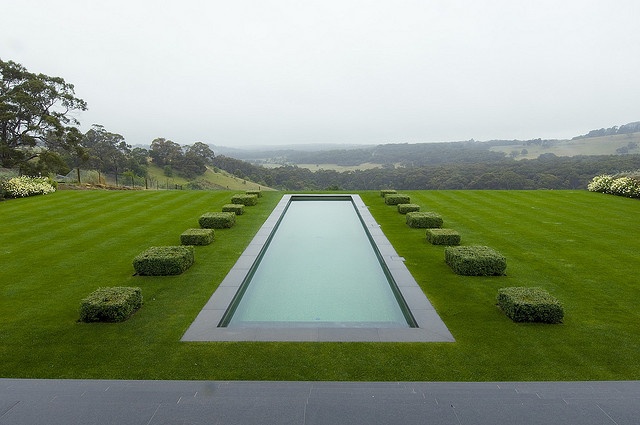 Elegant pool with square shrubs and beautiful view