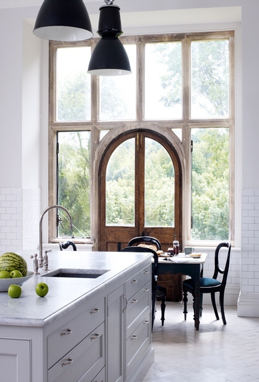 French white kitchen with floor to ceiling windows