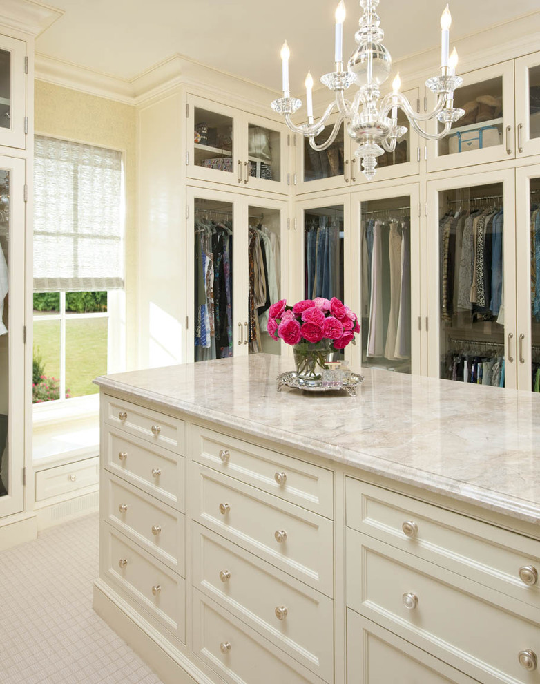 Glass cabinets inside a classic bedroom closet