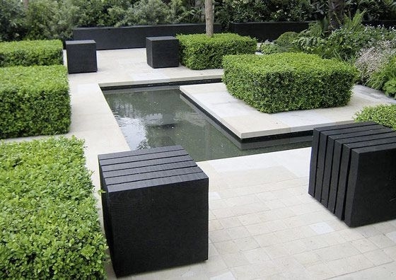 Lounge minimalist garden with tables and water pond