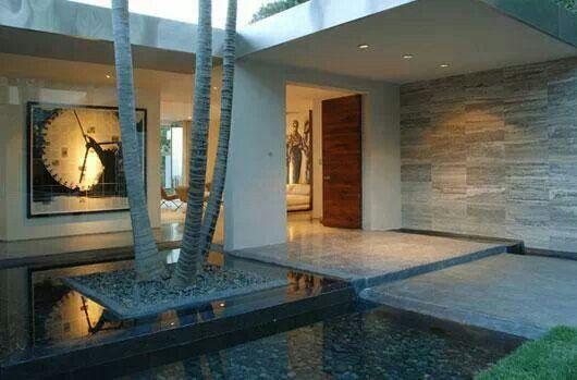 Minimalist inner garden with water features and trees