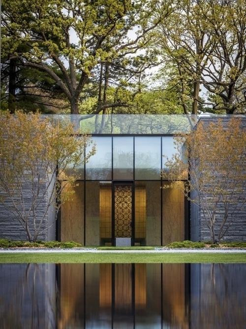 Minimalist pond that reflects the silhouette of the house