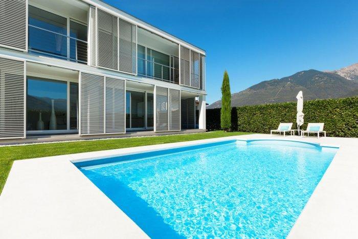 Minimalist swimming pool in front of a contemporary house