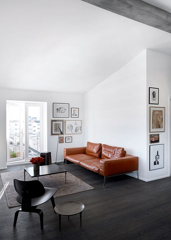 Modern brown leather sofa in a modern home in white