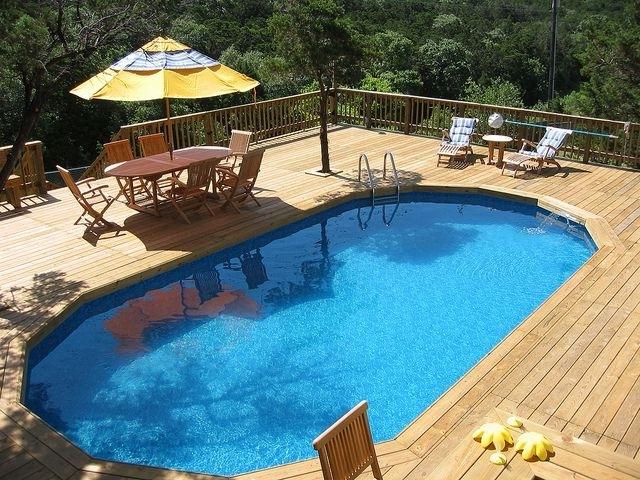 Modern pool with wooden deck