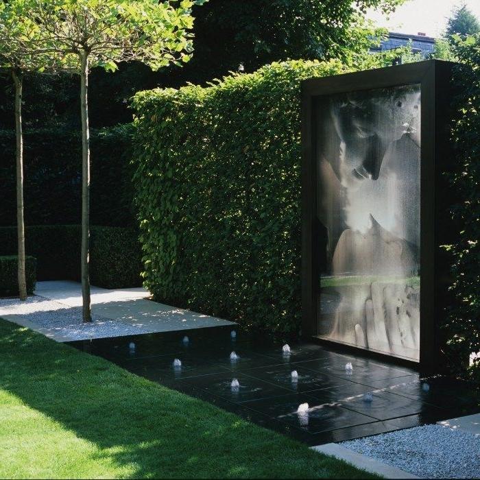 Modern sculptures and water features in a trendy garden