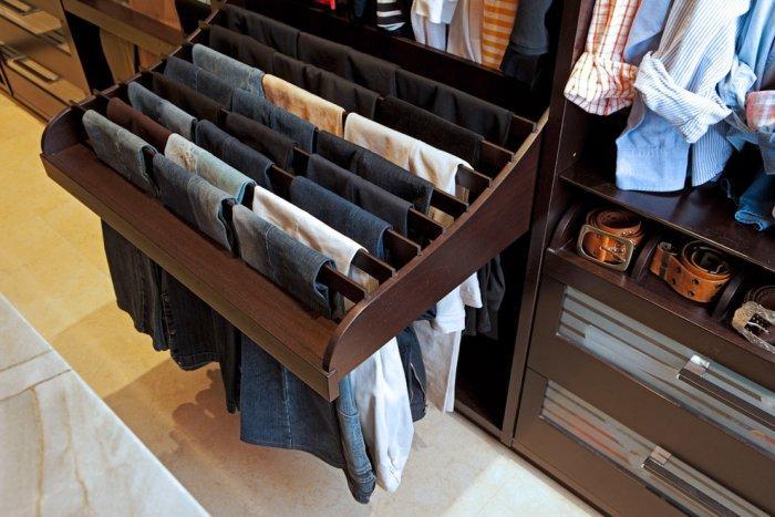 Pant rack with lots of pairs of jeans