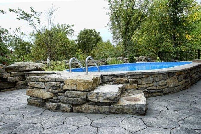 Pool with stone cladding installed one level up the ground