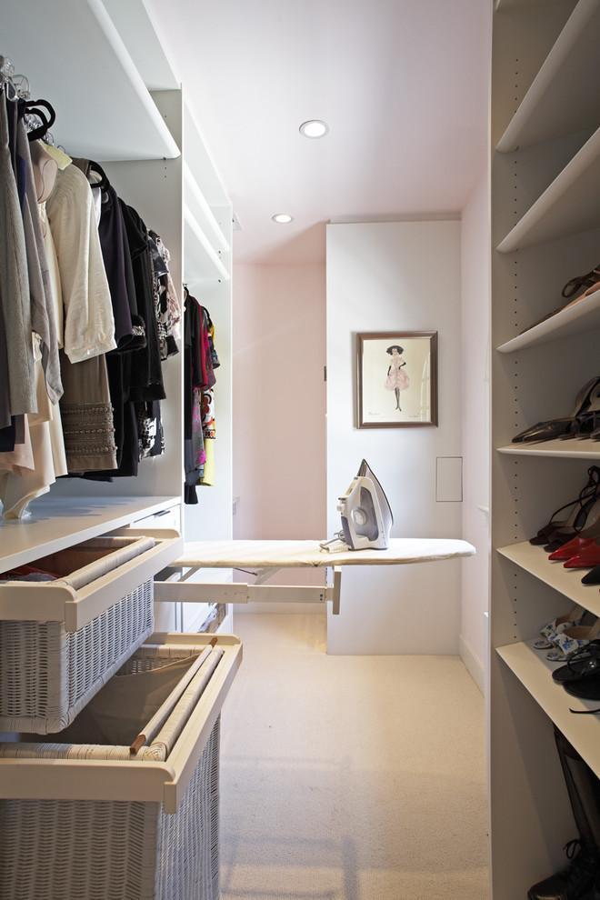 Pullout ironing board in a woman closet