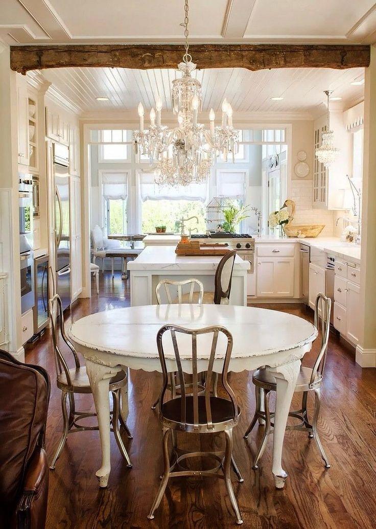 Shabby chic dining room with white oval table